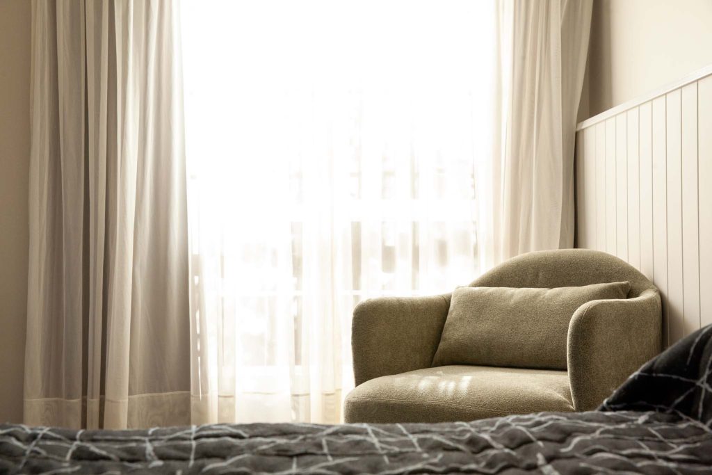 the kidman wayside inn olive-green armchair with a matching lumbar pillow