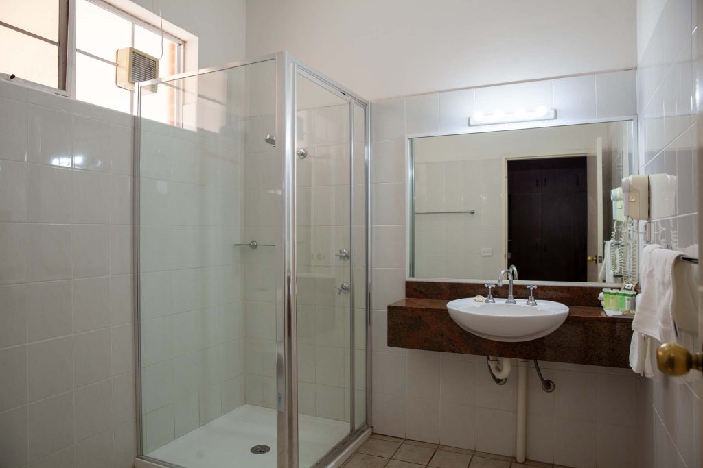 The Kidman Wayside Inn bathroom featuring a glass-enclosed walk-in shower